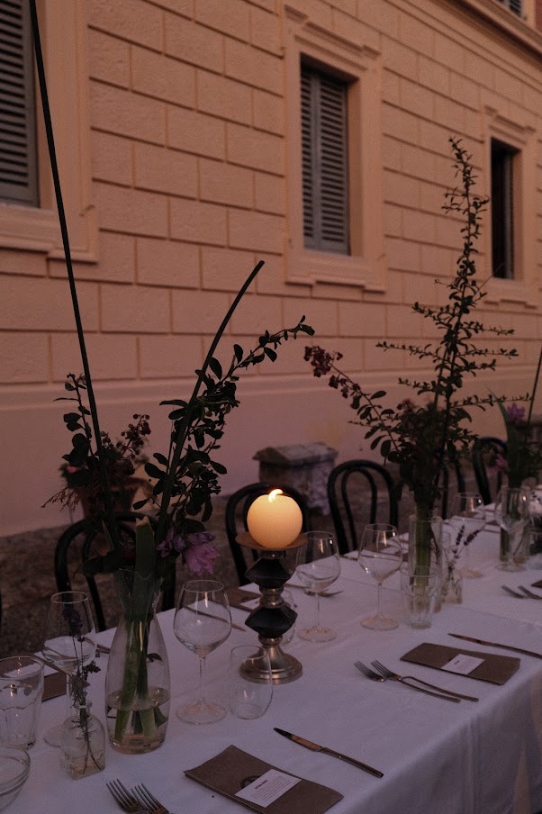 Candlelit table against the villa wall
